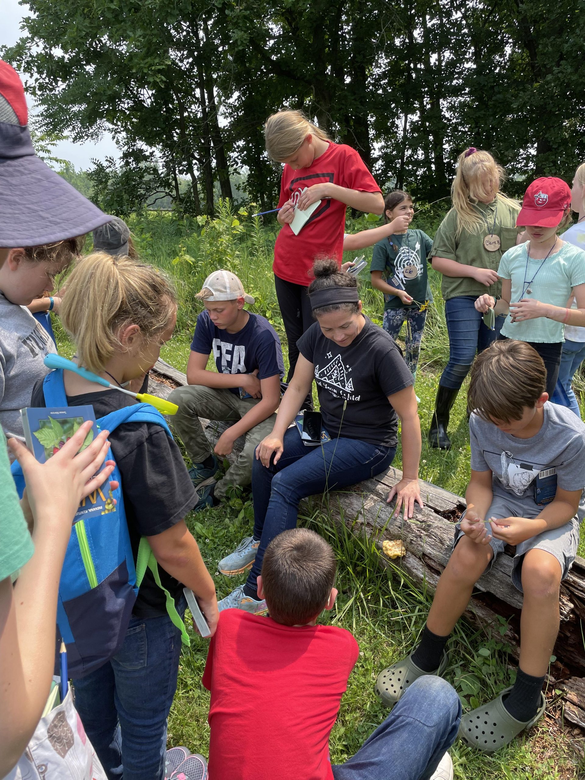 IMN Summer camp students learning about wild edibles